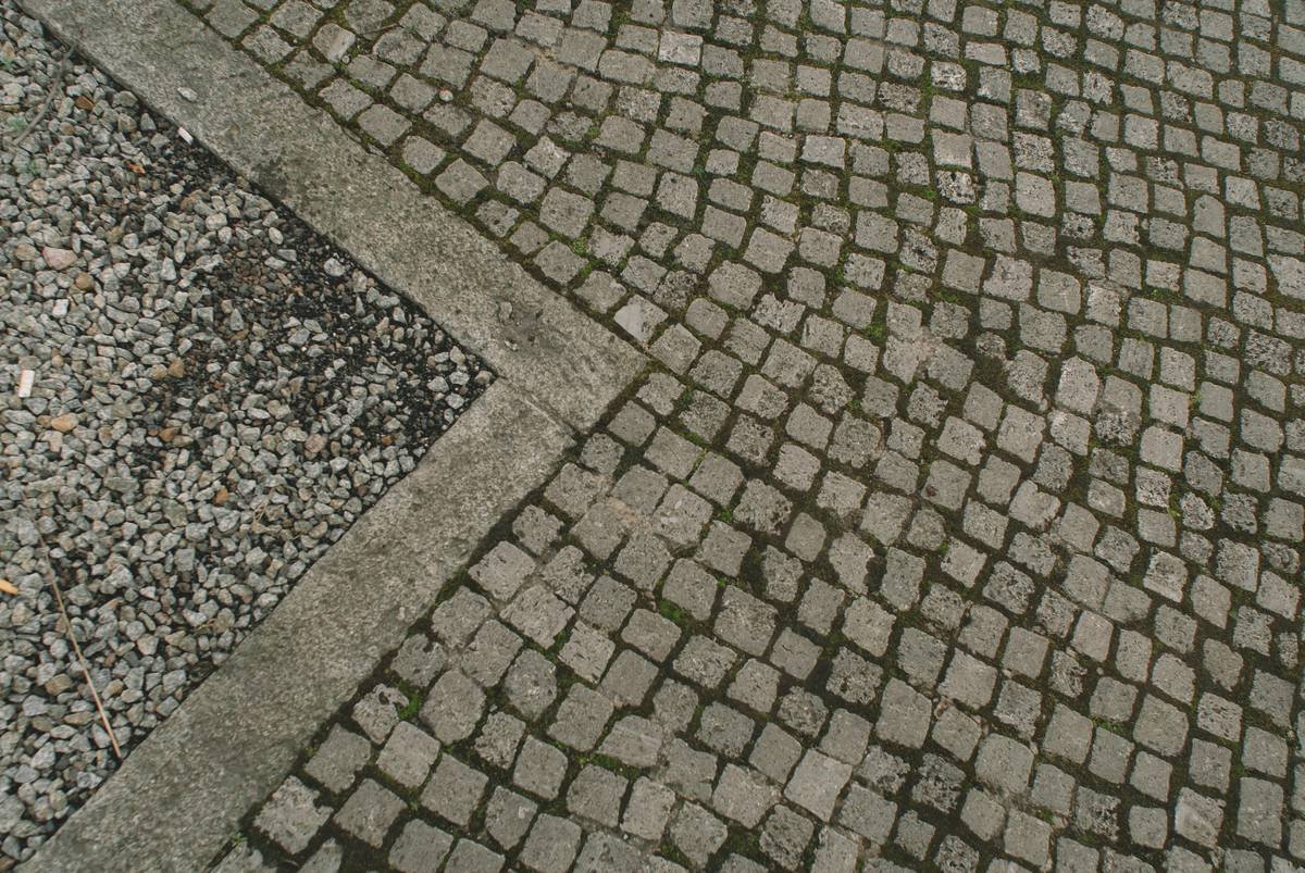 MotoGP rider leaning into corner with Surface Grip Guides overlay showing grip distribution